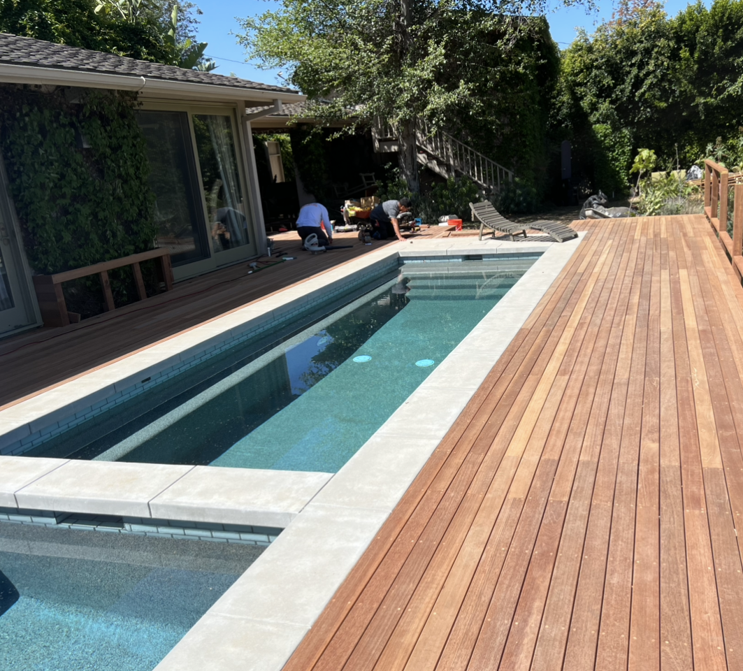 Raised pool on a hillside with wooden deck