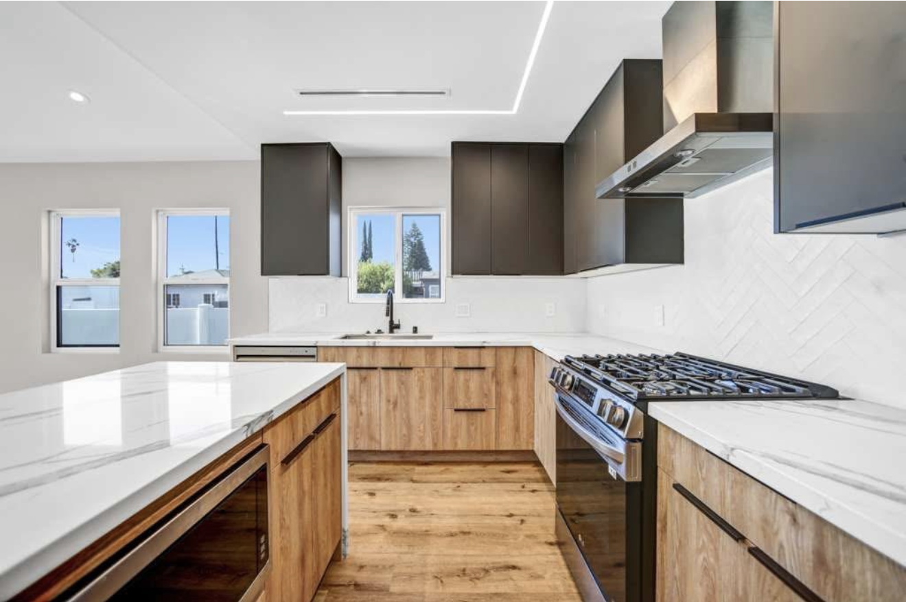Modern kitchen remodel with island and quartz counters