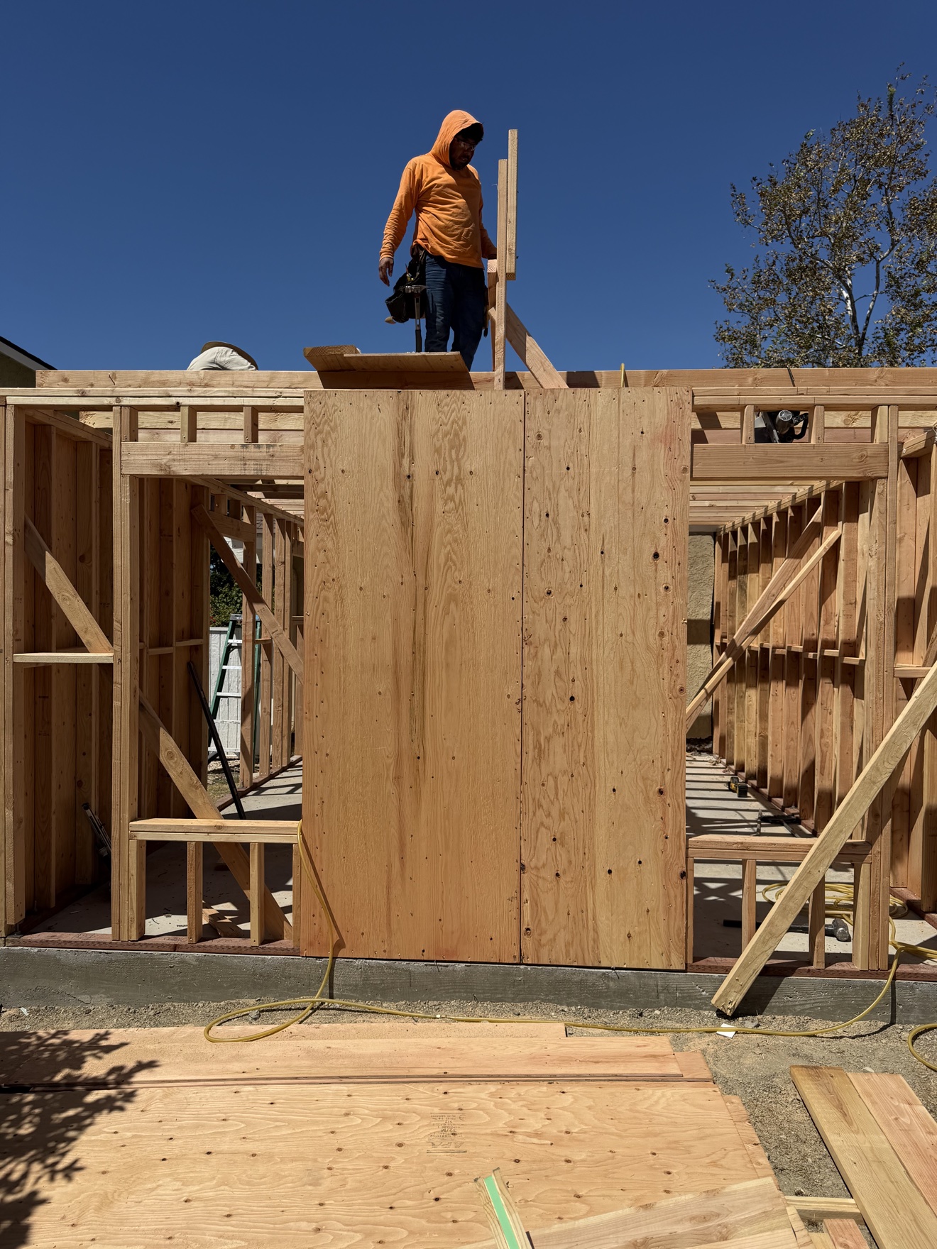 Plywood shear wall sheathing on home addition framing in Costa Mesa