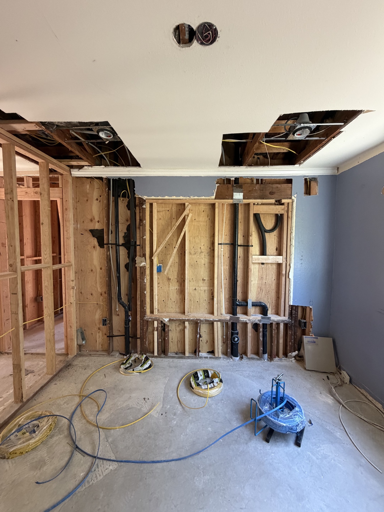 Rough plumbing and electrical in framed walls — home addition in Costa Mesa